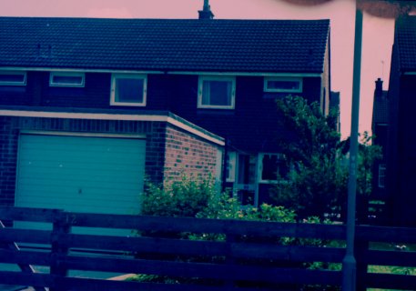 The back of our first house with the extra long garage. The back of our first house with the extra long garage.