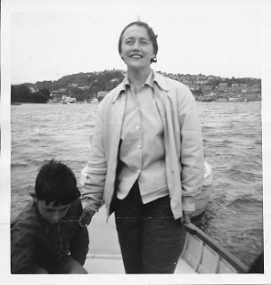 Mum takes the tiller of 'Invention on an early visit to Salcombe, towing a pram dinghy. I’m in this picture, probably taken by Daddy.
