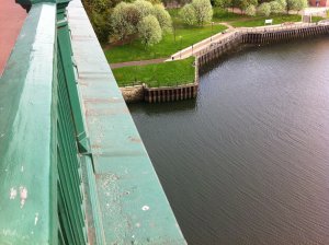 The ledge where James was sitting, his feet danging high above the water below.