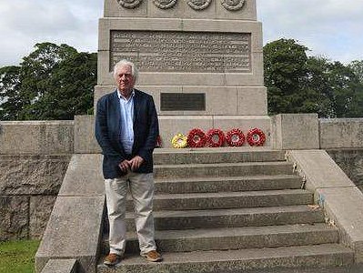 Eric with the canary yellow wreath at Carlisle War Memorial