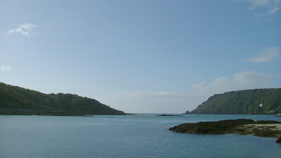 Salcombe, view from hotel moorings to the sea, low tide as Wolf Rock visible in middle. Sharpitor is the point on the right, Starehole Bay out past there to the right. 