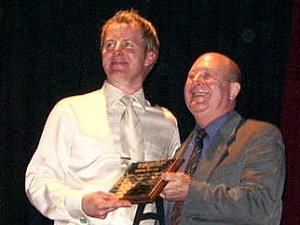 David presents Peter Featherstone with his award for club volunteer worker of the year.