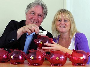 Eric with Mandy Johnston - and piggy banks