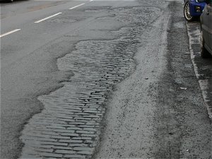 Etterby Street and holes.