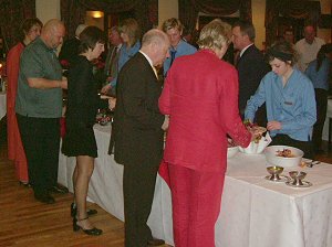 Guests, including David Clelland MP, get served with the excellent buffet meal