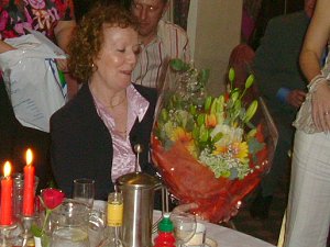 Meg is presented with a bouquet