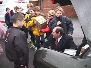 Children from Browney School help load a DHL van.
