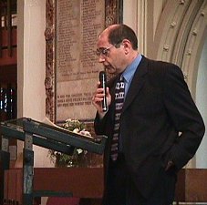 Gerry addresses the audience at St. Nic's